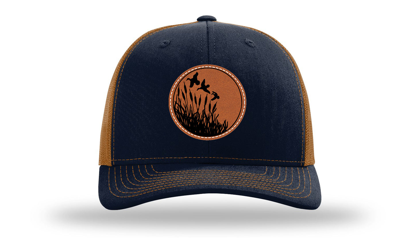 Ducks Fly Over Reeds Leather Patch Richardson 112 Hat-Navy / Caramel